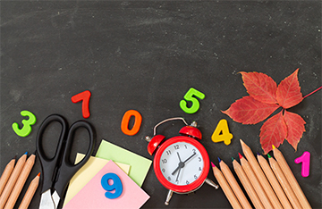 School supplies on a blackboard