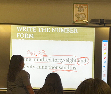 Write the number form lesson on a electronic bulletin board