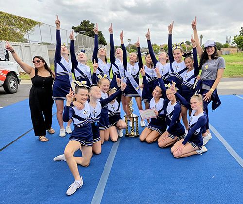 Nazareth School Cheer Team posing for a picture with trophy