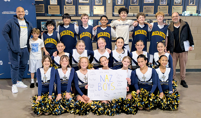Naz boys basketball team with cheerleaders and coaches