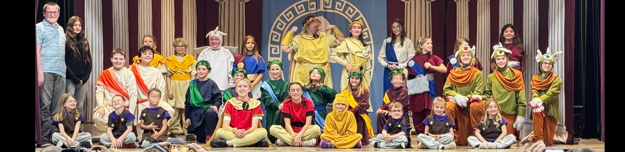 Students in costumes on the stage