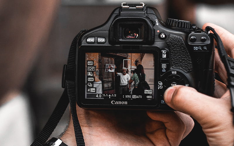 Hands holding a digital camera