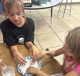 two students working on an experiment together