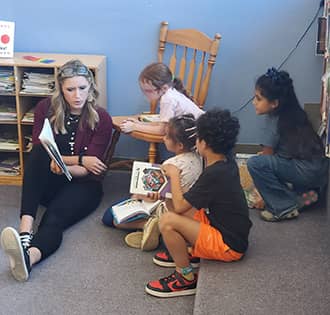 teacher reading to a student