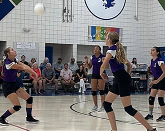 Students playing volleyball