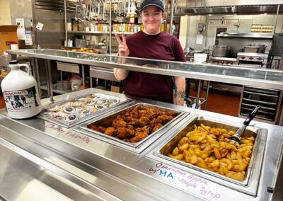 lunch lady showing food