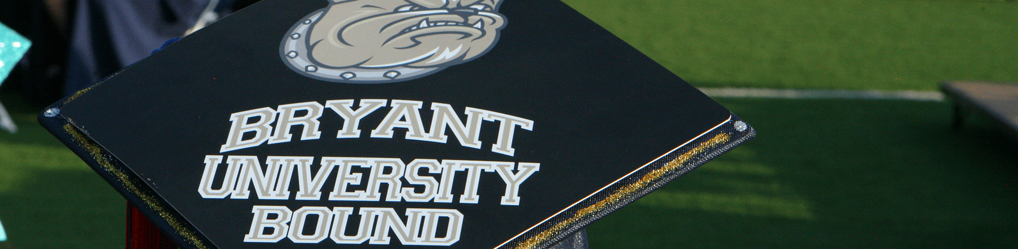 graduation cap that reads Bryant University Bound