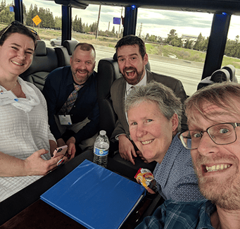 Staff members in a bus