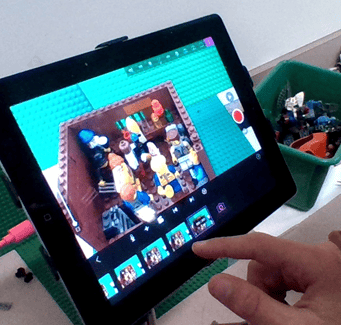 student using a tablet to make a video