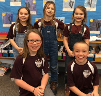 Students in soccer jerseys together