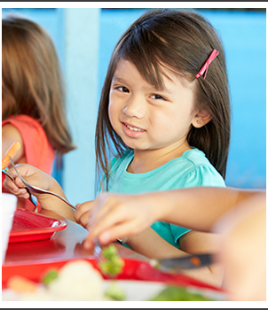 Little girl in a lunch room