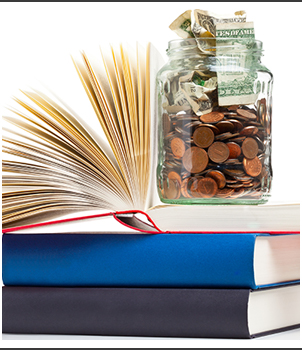 Jar filled with pennies and bills on top of books