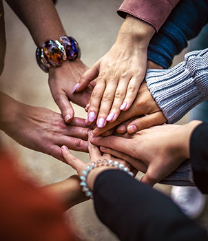 Hands reaching out and meeting in the middle