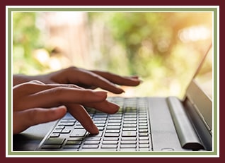 Parent filling out online registration on a laptop