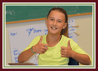 Female student with two thumbs up